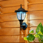 Set of two Midlothian matte black outdoor wall lanterns with integrated LED bulbs, 22cm tall, solar-powered for outdoor lighting.