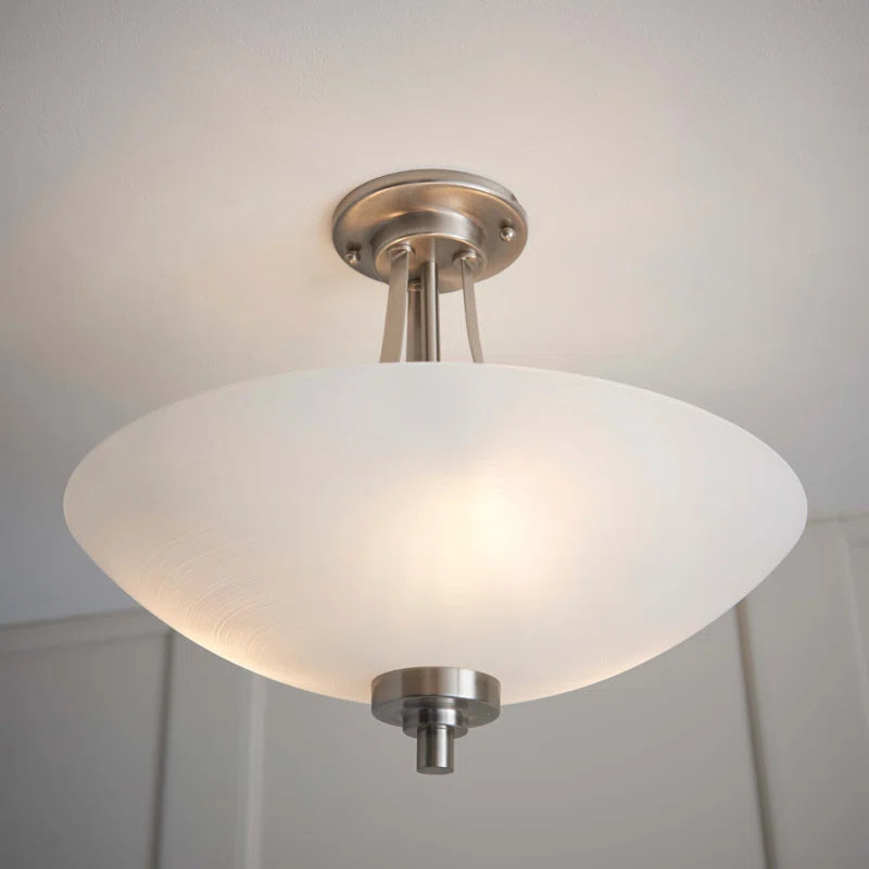 Miltiades glass semi-flush mount ceiling light by TheChandelierCo featuring a clear glass shade and metal fixture.
