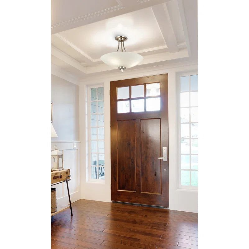 Miltiades glass semi-flush mount ceiling light by TheChandelierCo with clear glass shade and brushed metal finish.