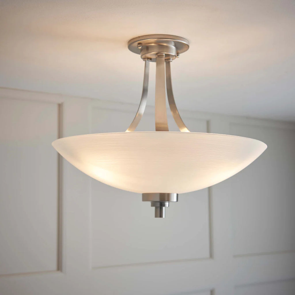 Miltiades glass semi-flush mount ceiling light by TheChandelierCo featuring a clear glass shade and modern design.