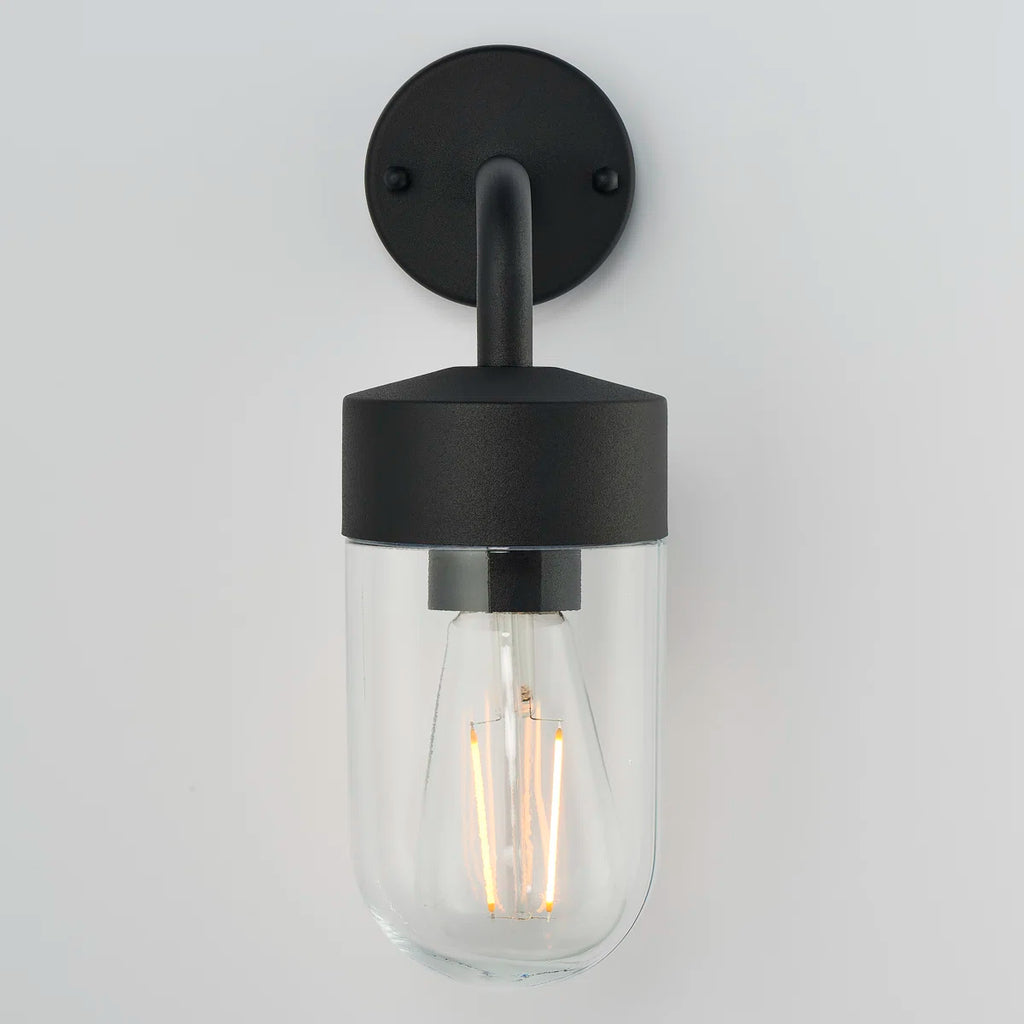 Myla 21cm H outdoor wall lantern by TheChandelierCo featuring a classic design with clear glass panels and black metal finish.