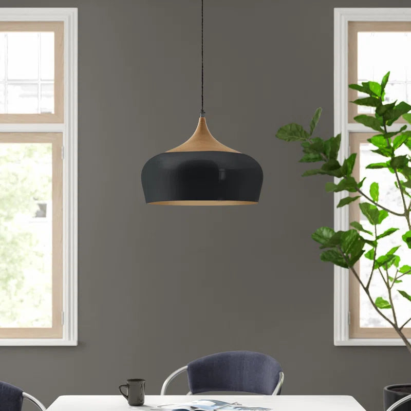 Nataly 1 Light Dome Pendant by TheChandelierCo hanging from ceiling with a sleek, modern design in a contemporary room setting.