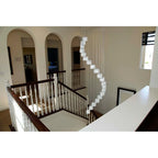 Neil 20-light cluster chandelier by TheChandelierCo with multiple glass globes hanging from a sleek metal frame.