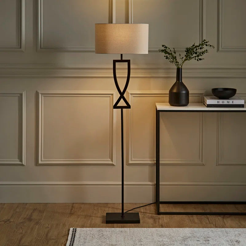 Black Randalstown floor lamp by TheChandelierCo, 145.5cm tall with a sleek, modern design for stylish lighting.