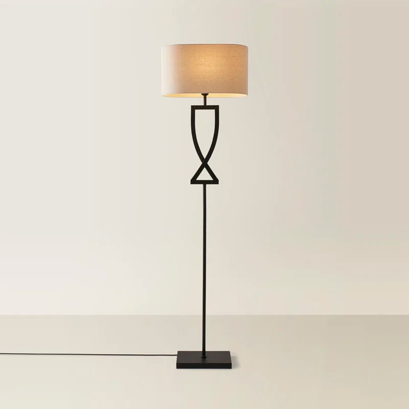 Black Randalstown floor lamp by TheChandelierCo, 145.5cm tall with a sleek modern design and a curved metal stand.