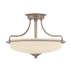 Glass semi-flush mount light fixture by TheChandelierCo with a sleek modern design and clear glass shade.