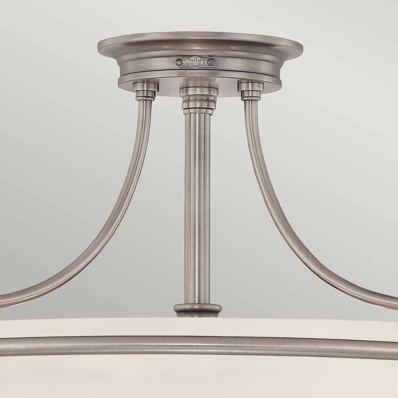 Elegant Rockwood glass semi-flush mount ceiling light by TheChandelierCo, featuring a sleek glass design and metal fixture.