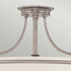 Elegant Rockwood glass semi-flush mount ceiling light by TheChandelierCo, featuring a sleek glass design and metal fixture.
