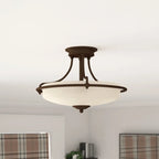 Elegant Rockwood glass semi flush mount ceiling light by TheChandelierCo, featuring a sleek, modern design and clear glass shade.