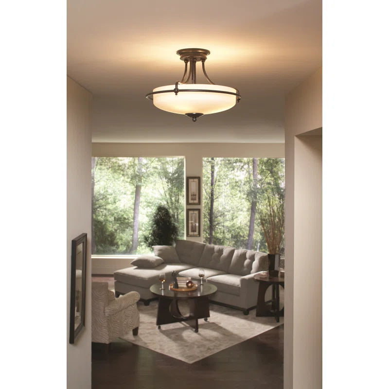 Elegant Rockwood glass semi-flush mount ceiling light by TheChandelierCo with clear glass shade and brushed metal finish.