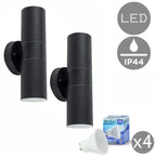 Set of two Schrager matte black outdoor armed sconces with four bulbs, wall-mounted lighting fixtures for exterior use.