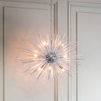 Sherlyn 9 light Sputnik chandelier by TheChandelierCo featuring a modern, starburst design with multiple exposed bulbs and a sleek metallic finish.