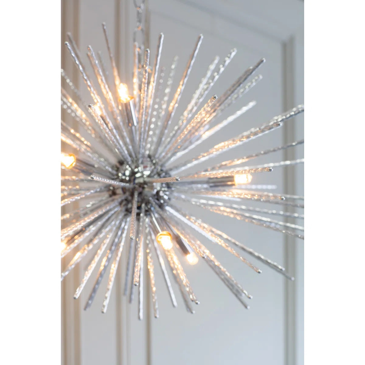 Sherlyn 9 Light Sputnik Chandelier by TheChandelierCo featuring a modern metallic design with nine exposed bulbs.