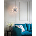 Sherlyn 9 Light Sputnik Chandelier by TheChandelierCo featuring a modern design with multiple adjustable arms and globe lights.