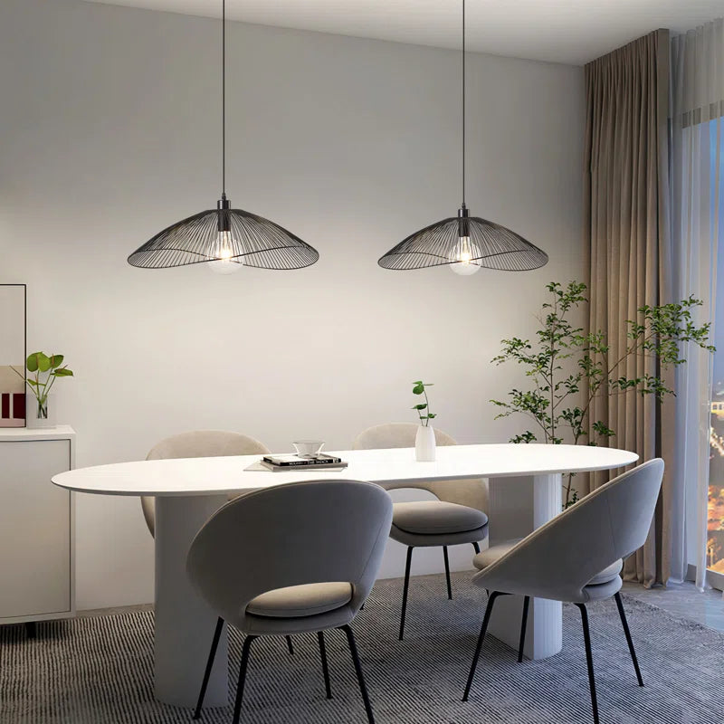 Light black Skookum 1 single pendant light by TheChandelierCo hanging from a ceiling with a sleek, modern design.