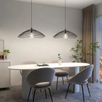 Light black Skookum 1 single pendant light by TheChandelierCo hanging from a ceiling with a sleek, modern design.