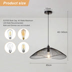 Light black Skookum 1 single pendant light fixture by TheChandelierCo hanging from the ceiling with a sleek design.