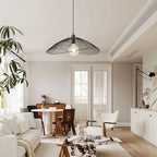 Light black Skookum 1 single pendant light by TheChandelierCo hanging with a sleek, modern design.