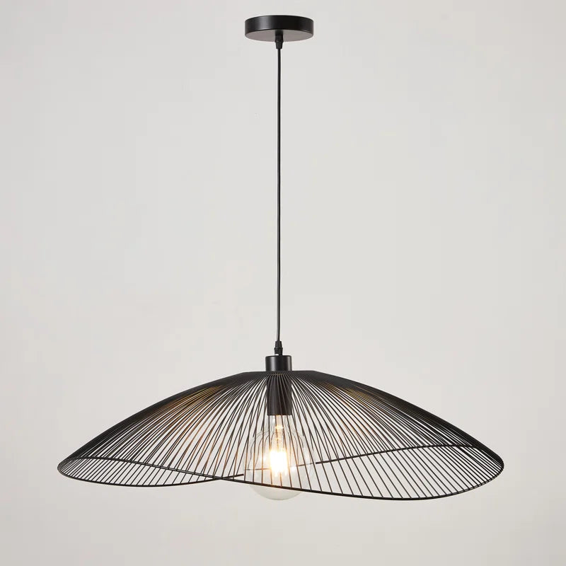 Light black Skookum 1 single pendant light by TheChandelierCo with a sleek, minimalist design hanging from a ceiling.
