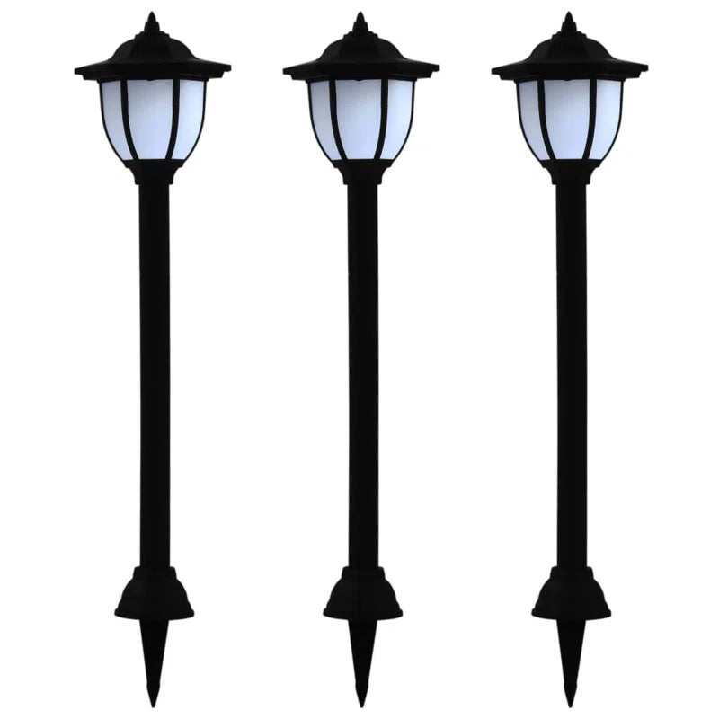 Set of three solar-powered pathway lights with integrated LED bulbs, ideal for outdoor garden or walkway illumination.