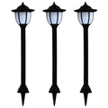Set of three solar-powered pathway lights with integrated LED bulbs, ideal for outdoor garden or walkway illumination.