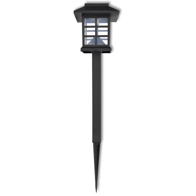 Set of 12 solar-powered LED pathway lights by TheChandelierCo, weather-resistant outdoor lights for garden or walkway illumination.