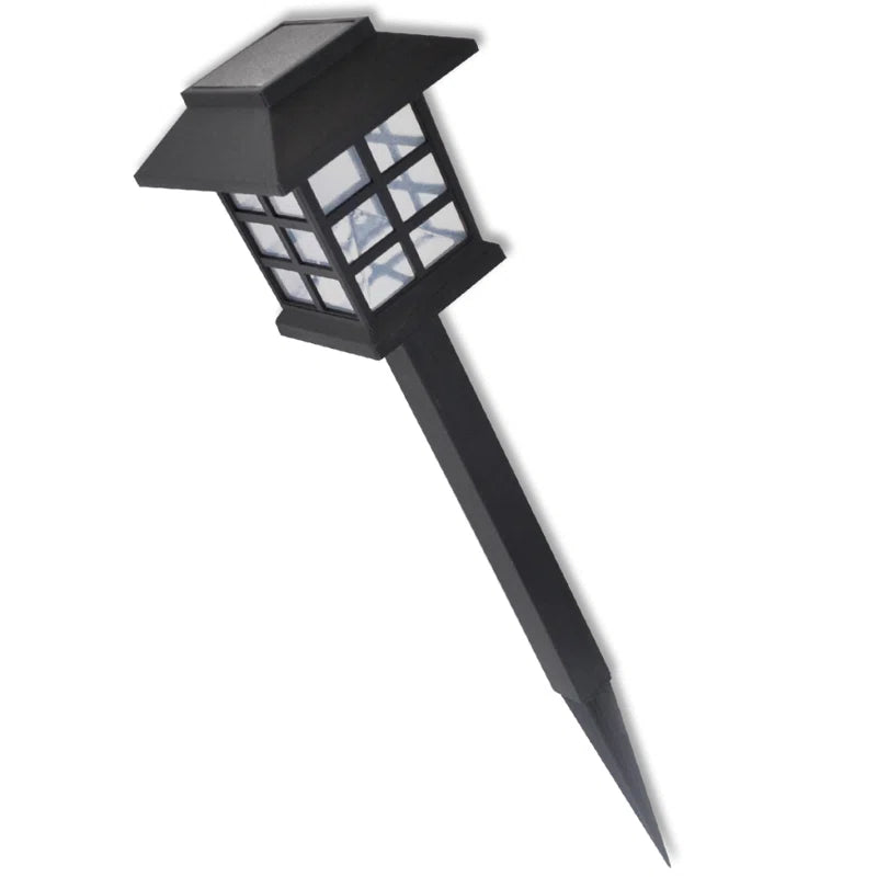 Set of 12 solar-powered pathway lights with integrated LED bulbs, weather-resistant design for outdoor garden or walkway illumination.