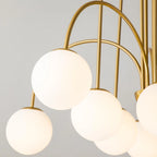 Modern Sputnik ceiling light by TheChandelierCo with 10 glass bubble bulbs, sleek design, and contemporary chandelier style.