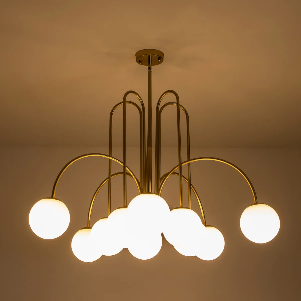 Modern Sputnik ceiling light by TheChandelierCo with 10 glass bubble bulbs and sleek metallic finish.