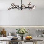 Modern Spoffo 15-light glass bubble chandelier by TheChandelierCo featuring a contemporary sputnik design for kitchen island lighting.