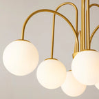 Six-light gold Sputnik ceiling chandelier with frosted white glass globe bubbles, modern contemporary design by TheChandelierCo.