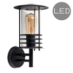 Black outdoor wall lantern with a classic design and clear glass panels, suitable for exterior lighting and porch decor.