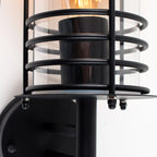 Black outdoor wall lantern with a classic design, featuring clear glass panels and a sturdy metal frame for outdoor lighting.