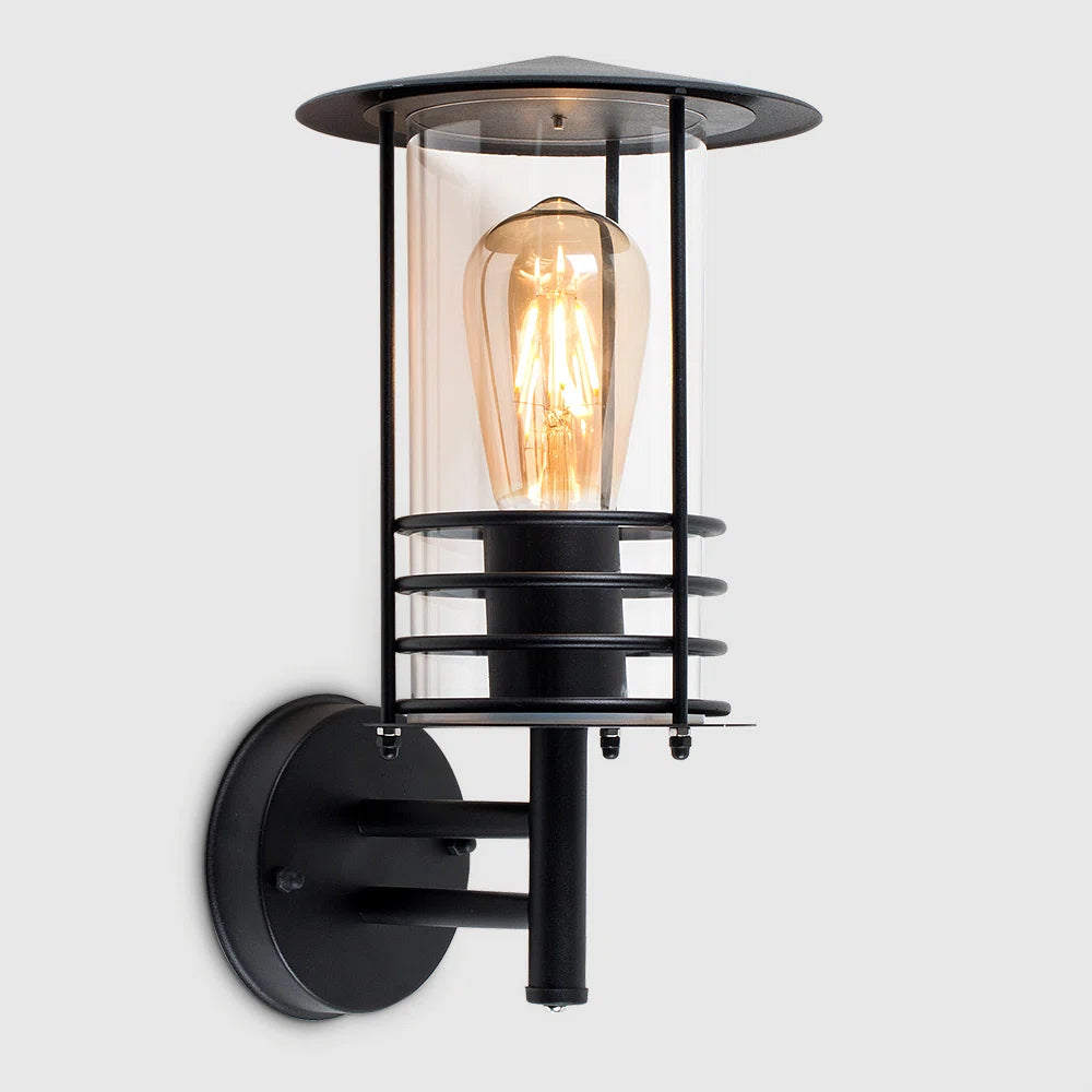 Black outdoor wall lantern with a classic design and clear glass panels, perfect for exterior lighting.