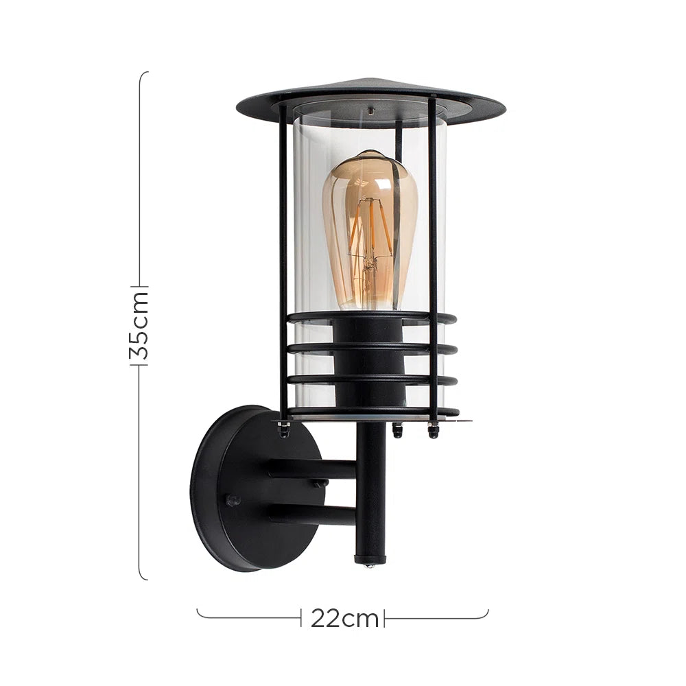 Black outdoor wall lantern with classic design, featuring a clear glass shade and metal frame for exterior lighting.