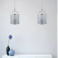 Strasburg 3-light lantern pendant by TheChandelierCo featuring vintage-style metal frame and glass lanterns hanging from a ceiling mount.