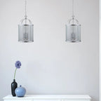 Strasburg 3-light lantern pendant by TheChandelierCo featuring vintage-style metal frame and glass lanterns hanging from a ceiling mount.
