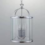 Three-light lantern pendant by TheChandelierCo featuring a classic design with metal framing and glass panels.