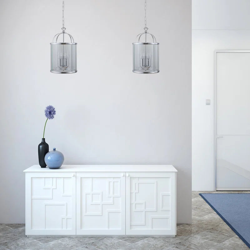 Strasburg 3 light lantern pendant by TheChandelierCo showing a vintage-style metal lantern with glass panels and hanging chain.