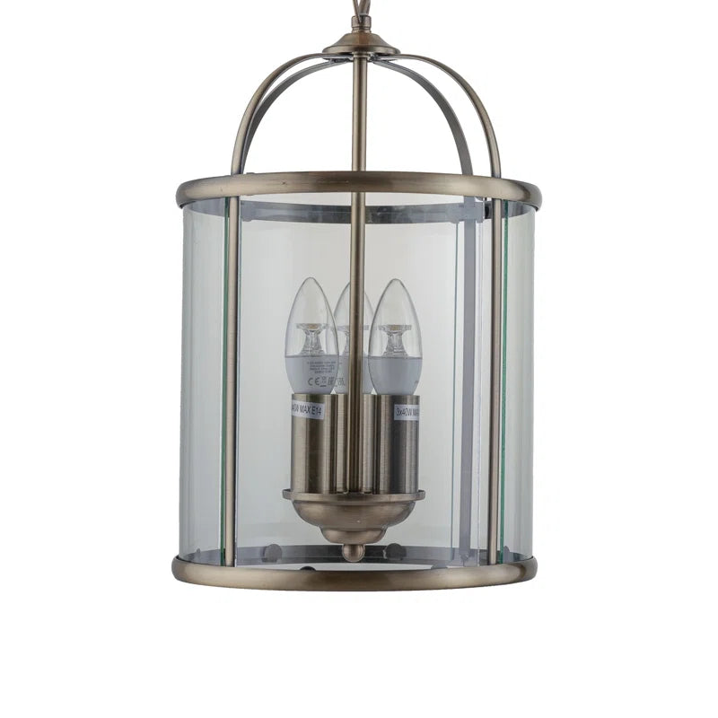 Three-light lantern pendant fixture from the Strasburg 3 collection by TheChandelierCo, featuring a classic metal frame and glass panels.