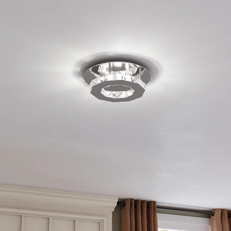 Tarren Glass LED flush mount ceiling light by TheChandelierCo with clear glass shade and modern design for contemporary interiors.