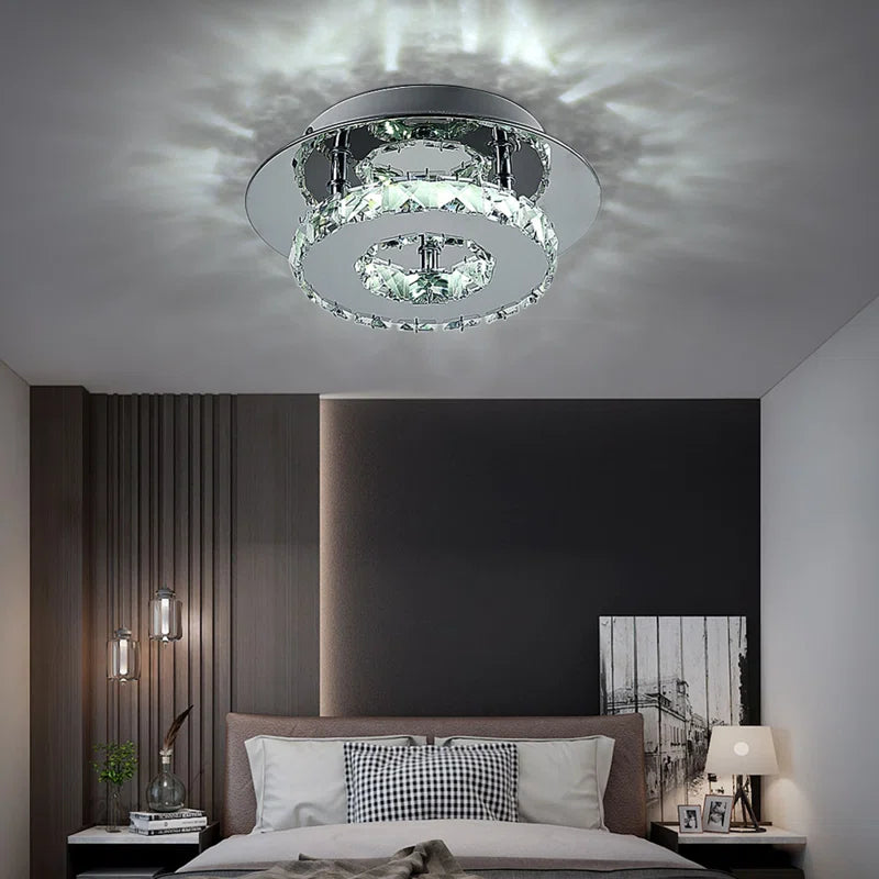 Tarren Glass LED flush mount ceiling light by TheChandelierCo featuring a modern glass design and integrated LED lighting.