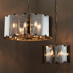 Tedrow 8-light drum chandelier by TheChandelierCo featuring a modern drum design with sleek metal finish and ambient lighting.