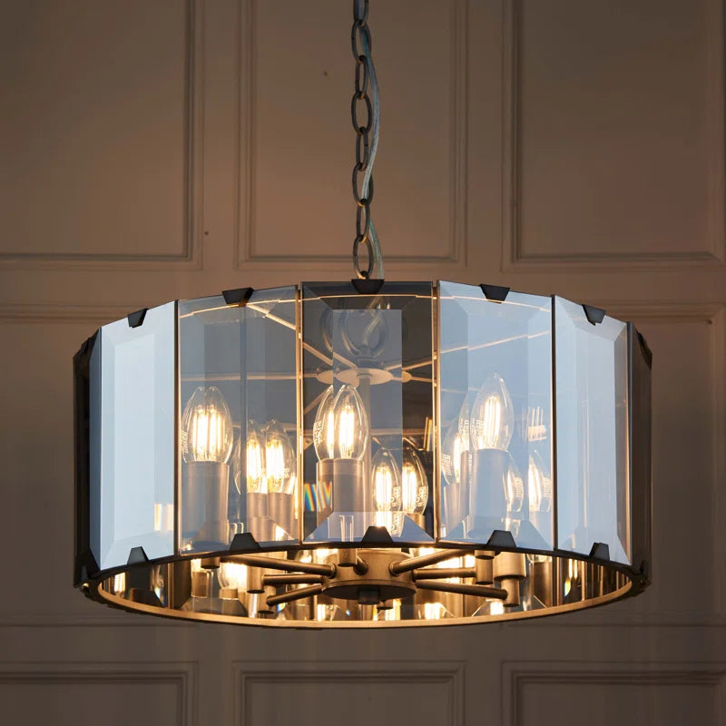 Tedrow 8-light drum chandelier by TheChandelierCo featuring a modern drum shade with warm metal accents, hanging from a sleek ceiling mount.
