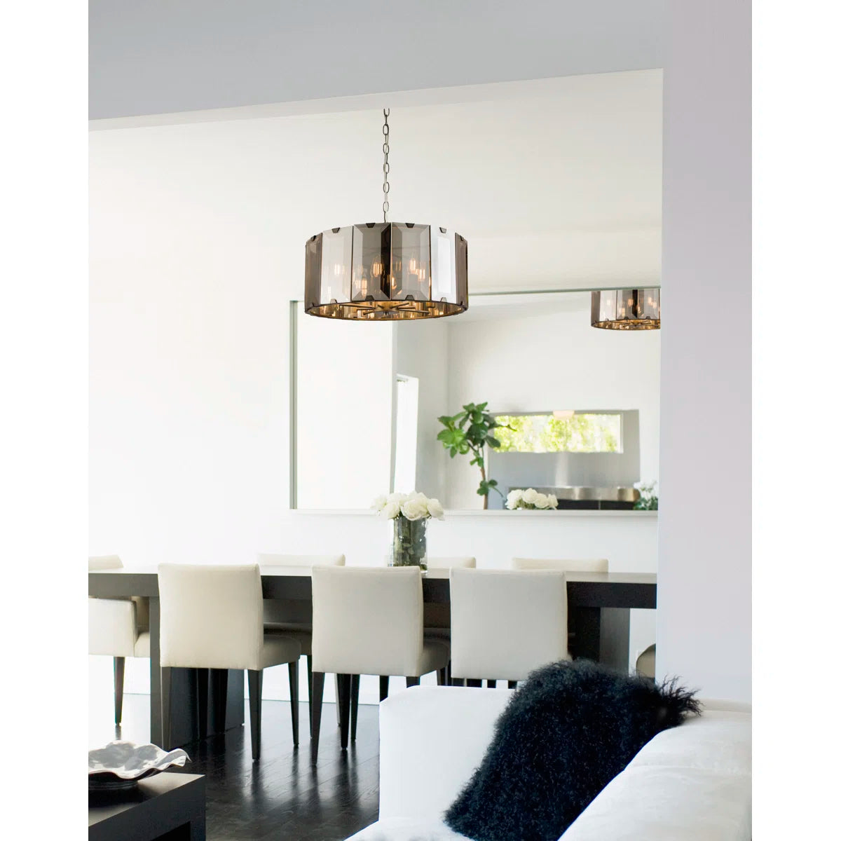 Tedrow 8 light drum chandelier by TheChandelierCo with a sleek drum shade and modern design, hanging from a ceiling fixture.