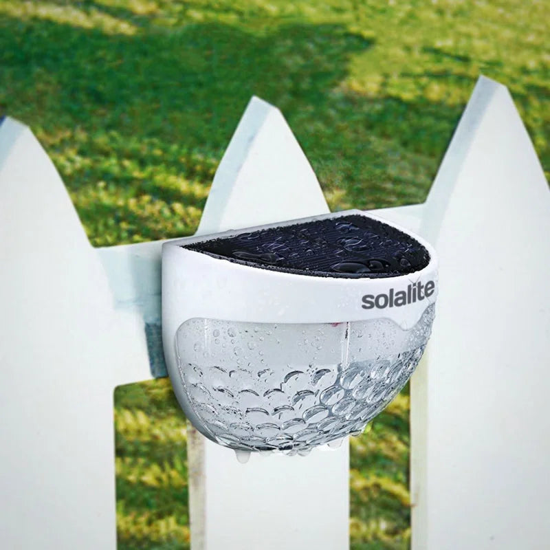 Set of two white 4.5cm H solar-powered LED outdoor bulkhead lights from TheChandelierCo, mounted on exterior walls.