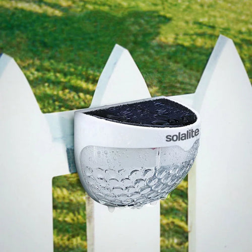 Set of two white 4.5cm H solar-powered LED outdoor bulkhead lights from TheChandelierCo, mounted on exterior walls.
