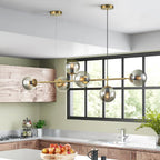 Light gold Worthington 6 linear Sputnik chandelier with globe glass bubbles, ideal as a kitchen island pendant lamp.