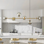 Light gold Worthington 6 linear Sputnik chandelier with globe glass bubbles, pendant lamp for kitchen island lighting by TheChandelierCo.