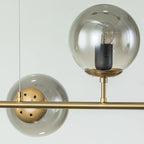 Light gold Worthington 6 linear Sputnik chandelier with globe glass bubbles, kitchen island pendant lamp by TheChandelierCo.
